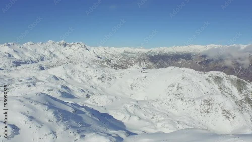 AERIAL: Ski lift in the mountains AERIAL: Ski lift in the mountains