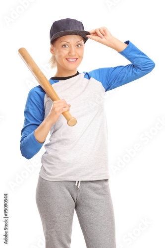 Young blond woman holding a baseball bat