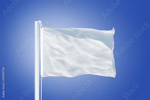 White flag flying against clear blue sky