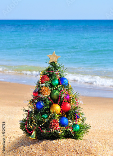 Christmas tree on sand in beach