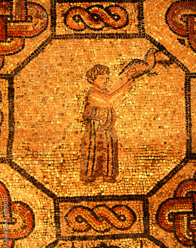 ancient roman mosaic: man releasing bird