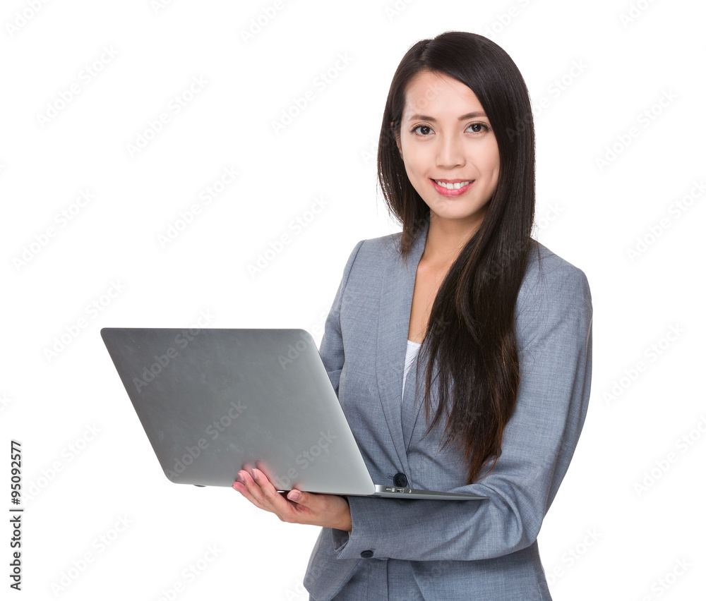 Asian Businesswoman use of the notebook computer Asian Businesswoman use of the notebook computer