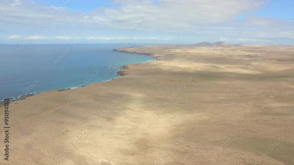 AERIAL: Big sandy desert and high cliff above the ocean AERIAL: Big sandy desert and high cliff above the ocean