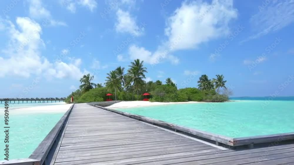 Wooden jetty and water villas in exotic island of Maldives Wooden jetty and water villas in exotic island of Maldives