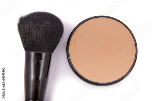 face powder with a brush close up on a white background