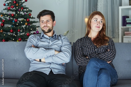 young modern couple is irritated of christmas