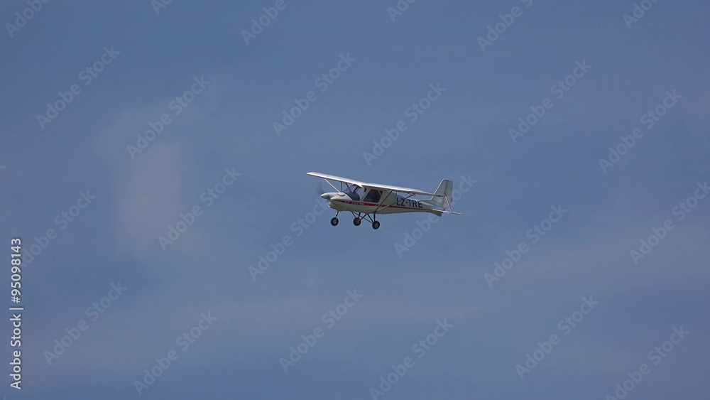 Small grey airplane with propeller engines flying Small grey airplane with propeller engines flying