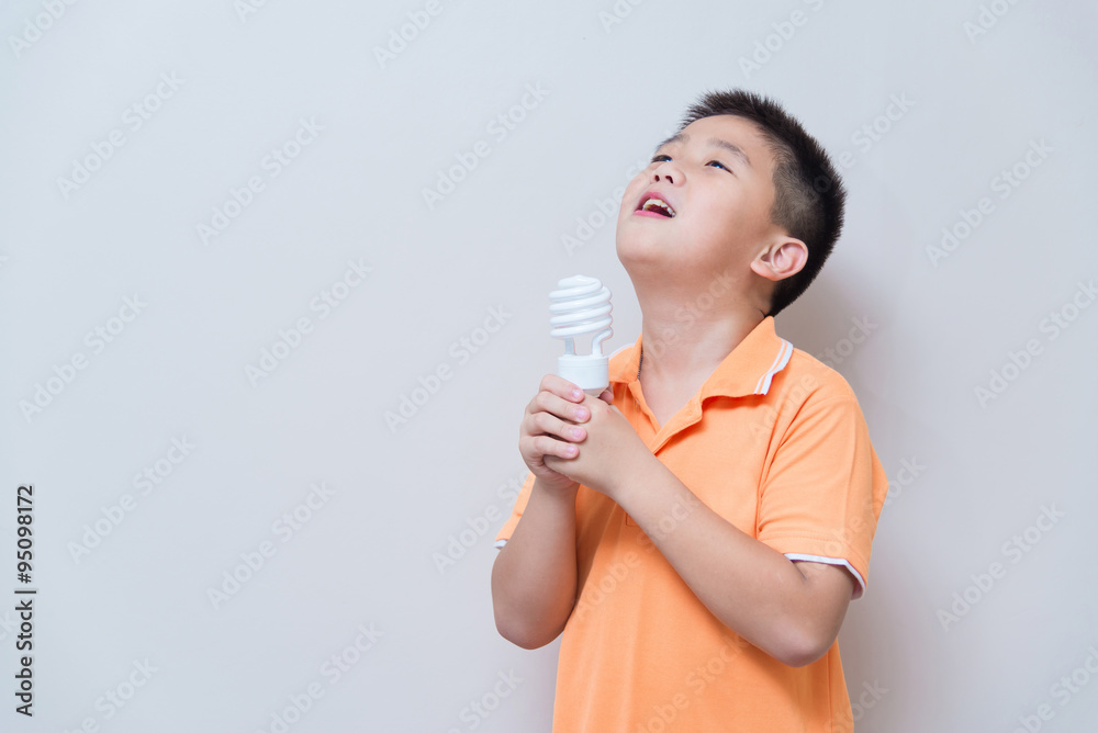 Asian boy joking gesture licking fake ice cream made with energy Asian boy joking gesture licking fake ice cream made with energy