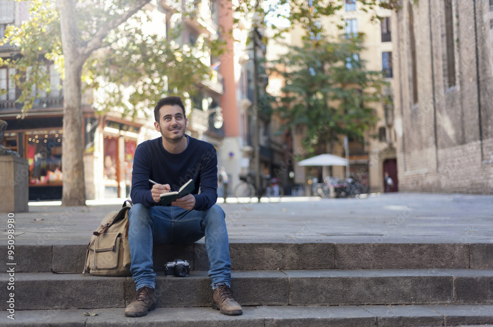 Obraz premium Young man taking photos in Barcelona