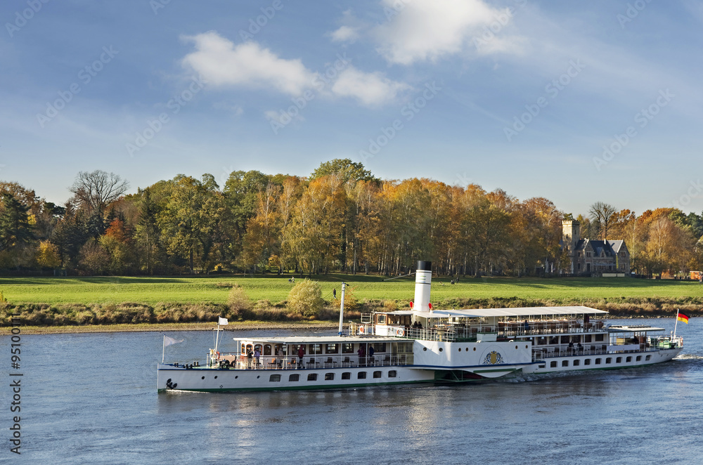 Fototapeta premium Steamship in Elbe river.Old ship in Elbe river near Dresden in during a bright autumn day. Saxony,Germany.