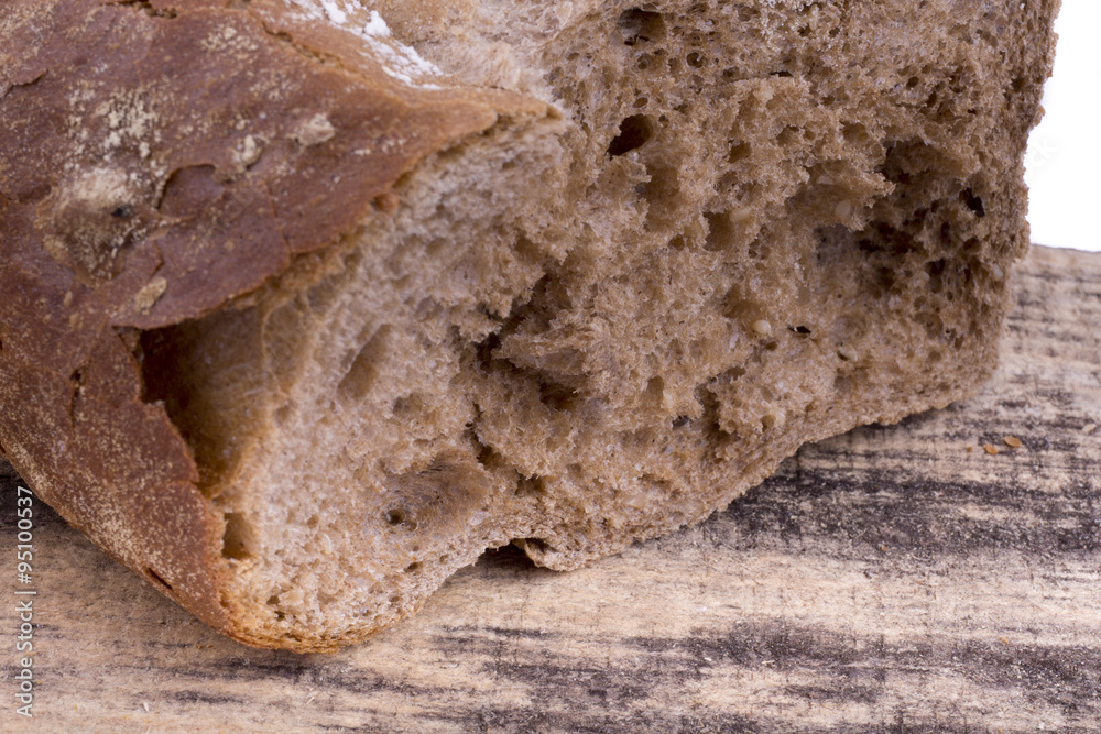 fresh rye bread on a wooden background