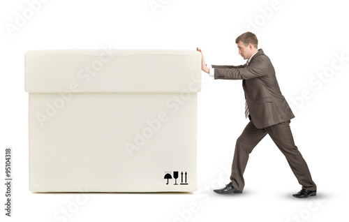 Businessman pushing big white box