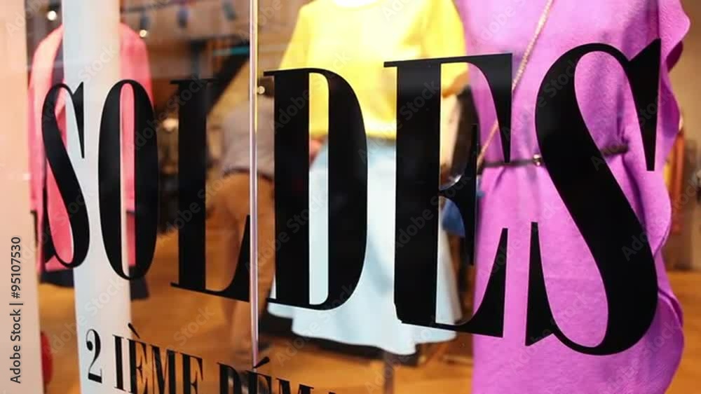 Woman going through clothes in store