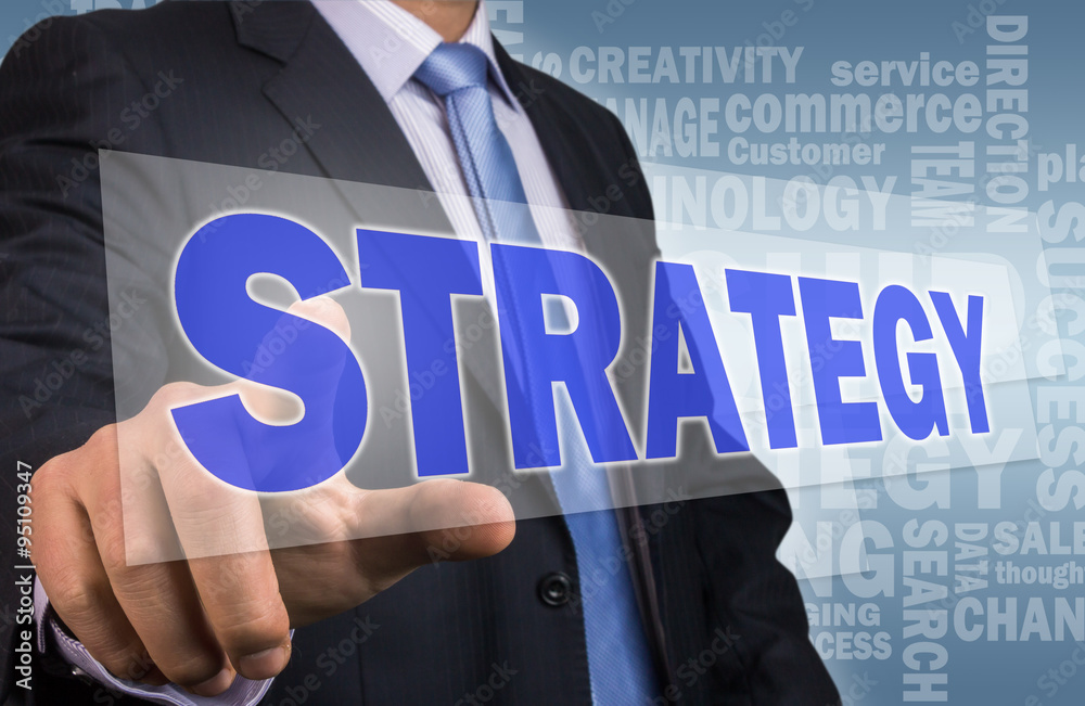 businessman press strategy button from touch screen interface businessman press strategy button from touch screen interface