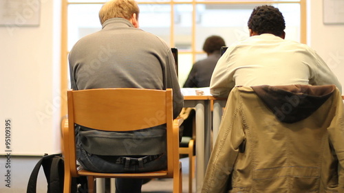 University students take exam and cheat photo