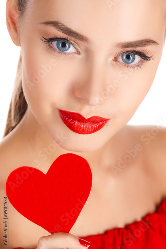 Portrait of beautiful girl with red heart