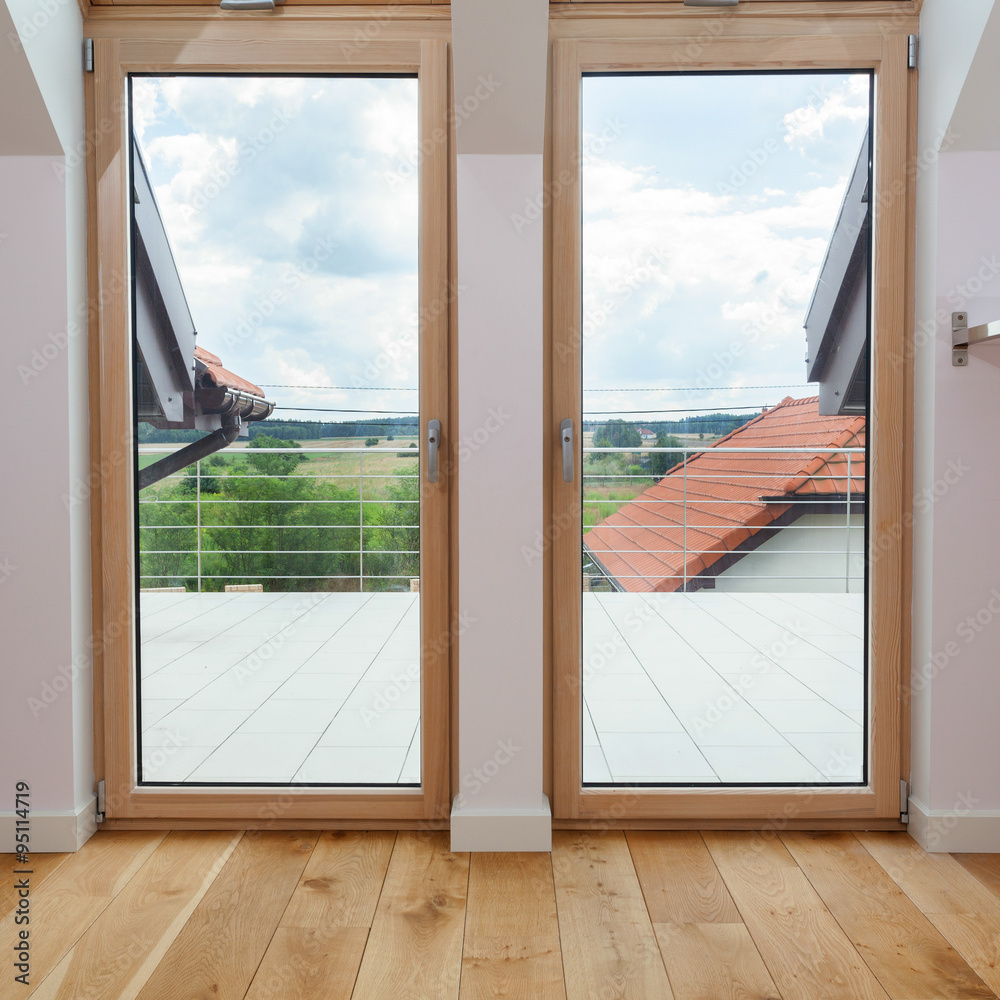 Fototapeta premium Double door to a terrace with beautiful view