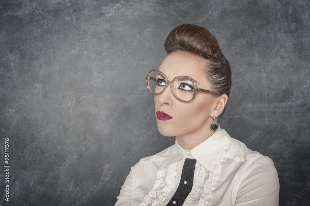 Woman in eyeglasses looking on something Woman in eyeglasses looking on something