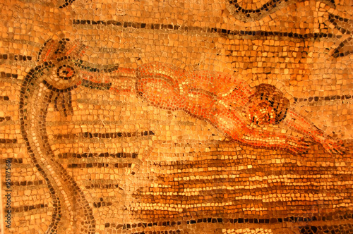 roman mosaic of a man being swallowed by a sea monster