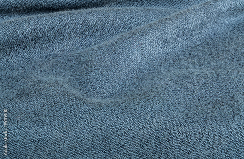 Closeup wrinkled blue jacket fabric background