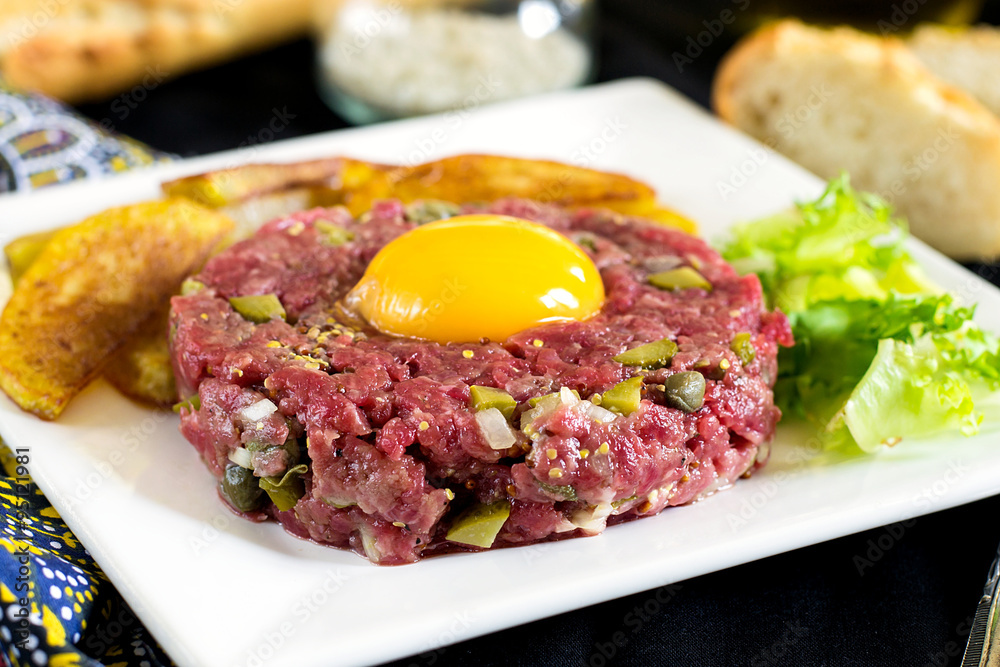 Raw beef steak tartare with French fries Raw beef steak tartare with French fries