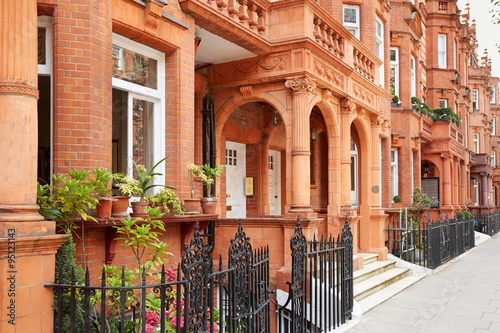 Photography Row of red bricks houses in London, english architecture