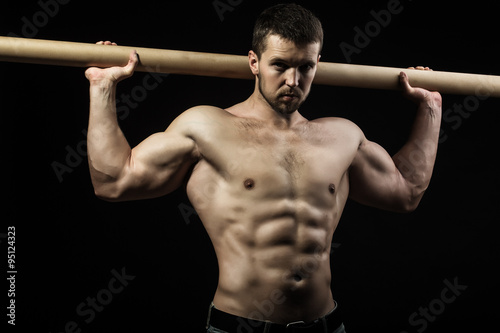 Muscular man with crossbar