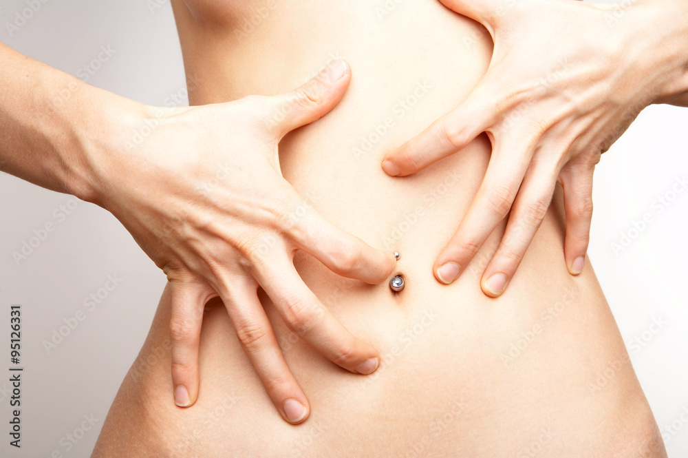 stomach with hand, close up stomach with hand, close up