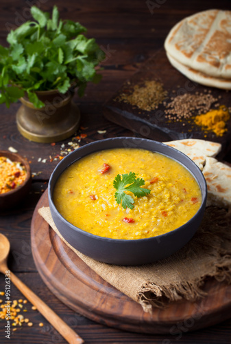 Red lentil Indian soup with flat bread. Masoor dal. 