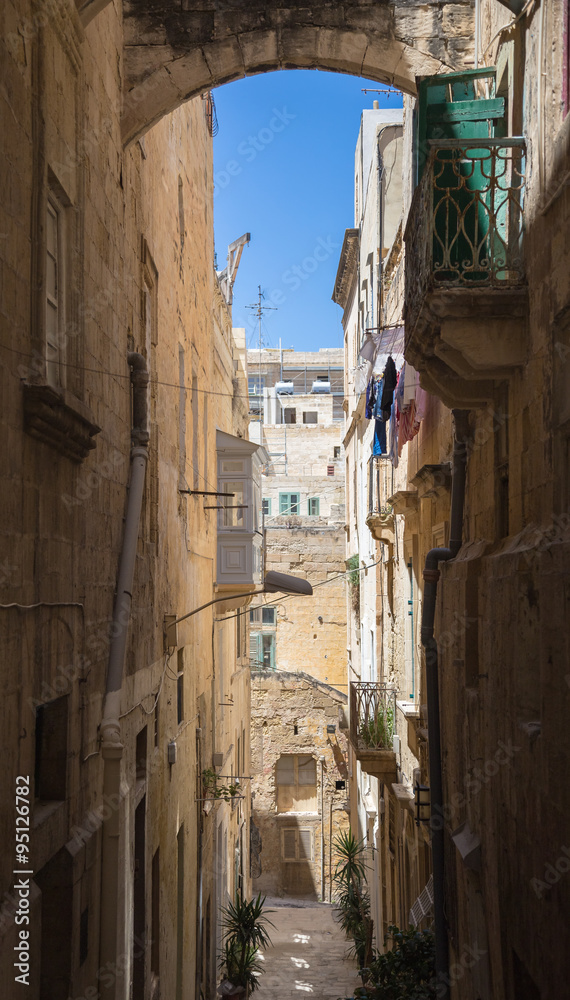 Malta streetview with arch and blue sky, Valetta