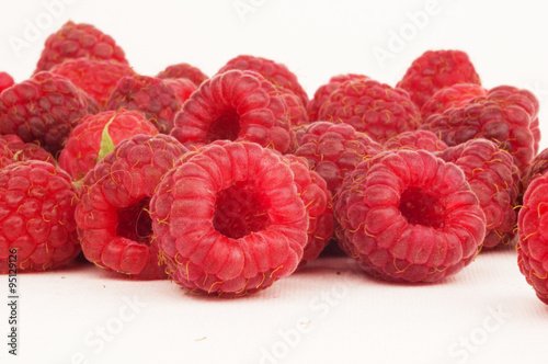 Ripe raspberries isolated on white background