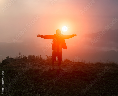 Tourist on the mountains during sunrise