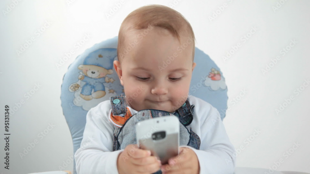 Baby plays with cellphone