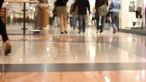 Shopping mall shoppers walk in the aisle 1