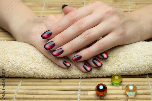 Beautiful woman s nails with nice stylish manicure in the salon