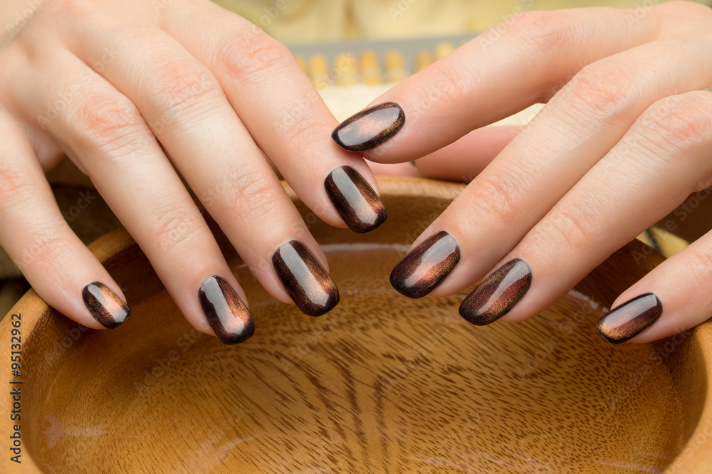 Beautiful woman's nails with nice stylish manicure in the salon