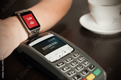 Man making payment through smartwatch via NFC technology photo