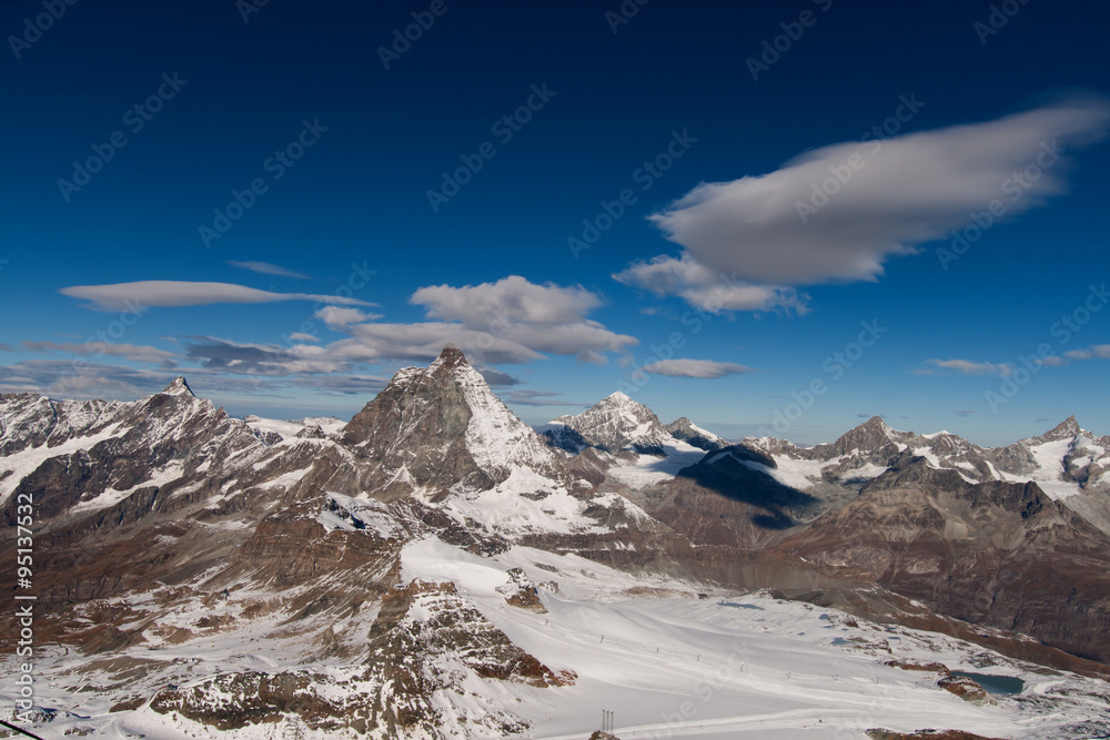 Fototapeta premium Matterhorn covered with clouds on a clear day after snow fall in autumn, Valais, Switzerland