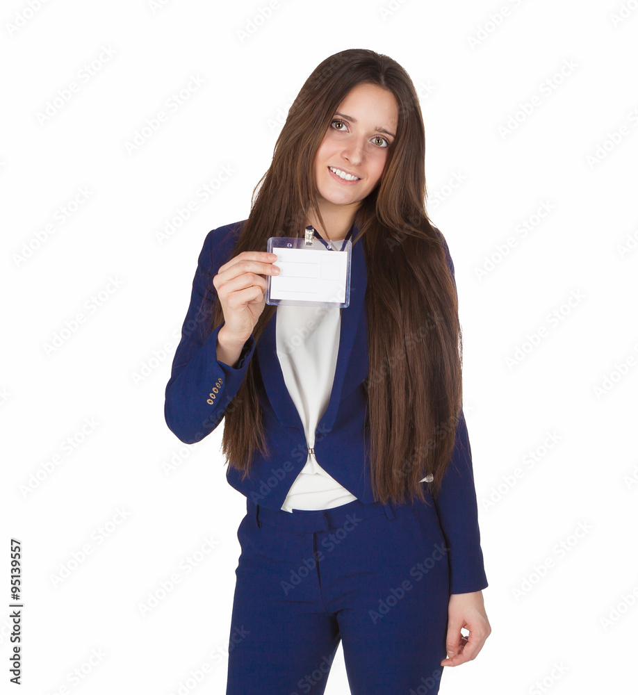 Young beautiful business lady in blue costume shows her badge of participant proudly with smile isolated. Young beautiful business lady in blue costume shows her badge of participant proudly with smile isolated.