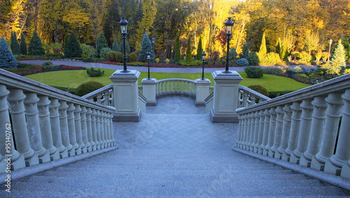 beautiful classical staircase with autumn park view