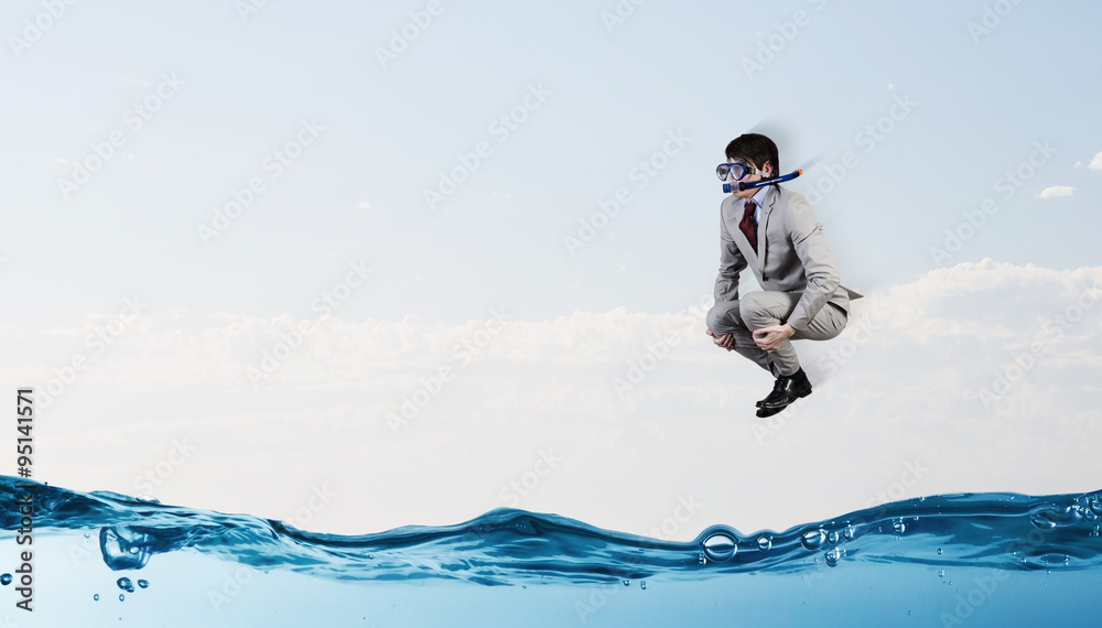 Diving businessman . Concept image