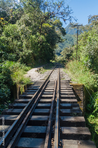 Fototapeta Naklejka Na Ścianę i Meble -  Railway track in Urubamba river valley near Aguas Calientes village, Peru