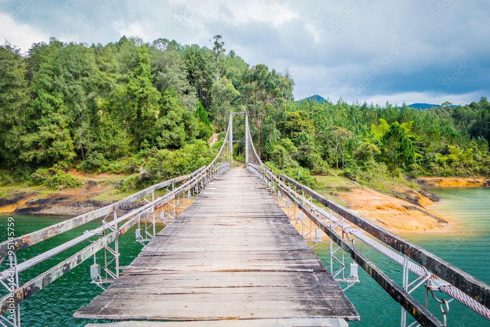 Wooden suspension bridge in Guatape, Colombia