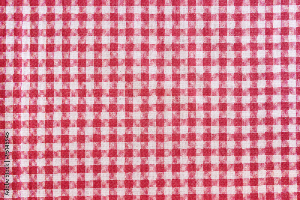 Red picnic tablecloth background, checkered fabric texture. Red picnic tablecloth background, checkered fabric texture.