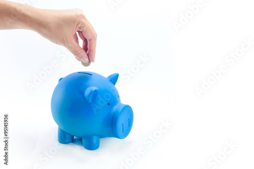 Piggy Bank and Coin in Female Hands on white isolated