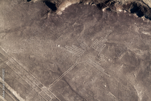 Aerial view of geoglyphs near Nazca - famous Nazca Lines, Peru. In the center, Hummingbird figure is present