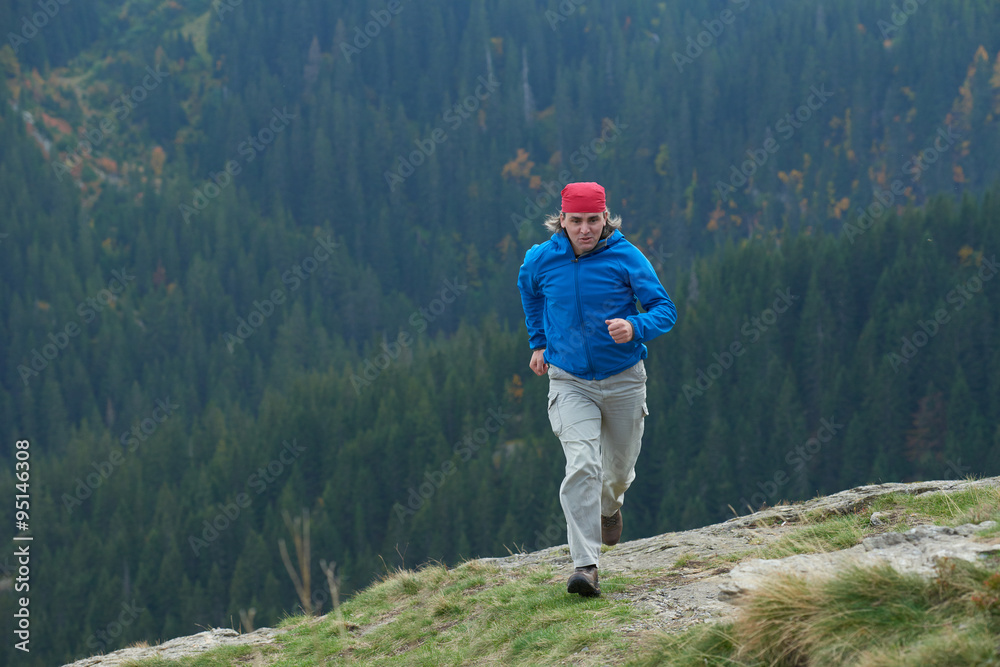 Fototapeta premium advanture man with backpack hiking