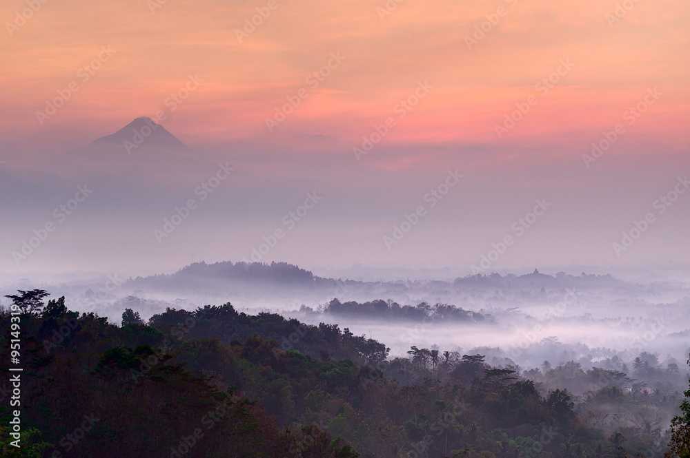 Pre-dawn at Setumbu hill with the view of Borobudur and  Merapi