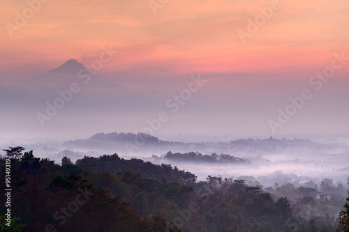 Pre-dawn at Setumbu hill with the view of Borobudur and Merapi