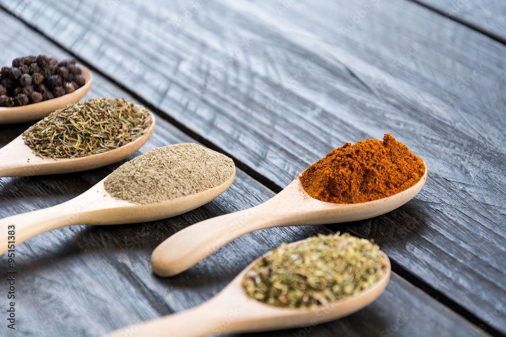 Spices and herbs in  bowls.